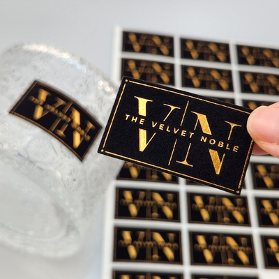 kaufen Hochwertige, kundenspezifische, geprägte UV-Goldfolien-Druckkarte, Prägegold-Kunstdruckpapier, Samt-Goldpräge-Etikettenaufkleber für Parfüm & Party online manufacture